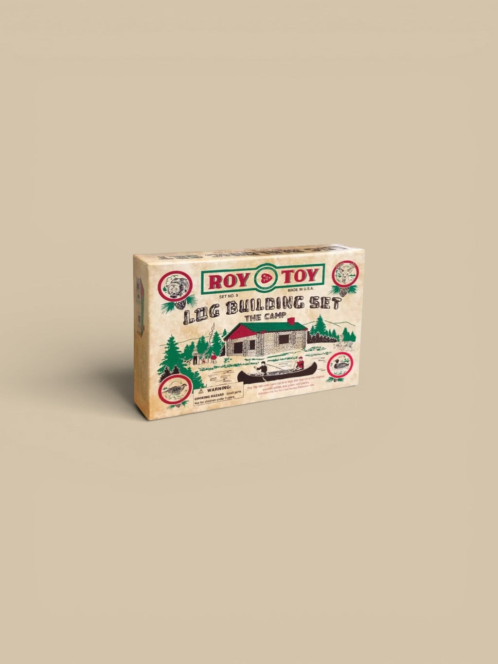 Homestyle Collective Roy Toy 1930's Log Building Set, wooden log cabin construction toy with green roof, canoe, and forest animals.