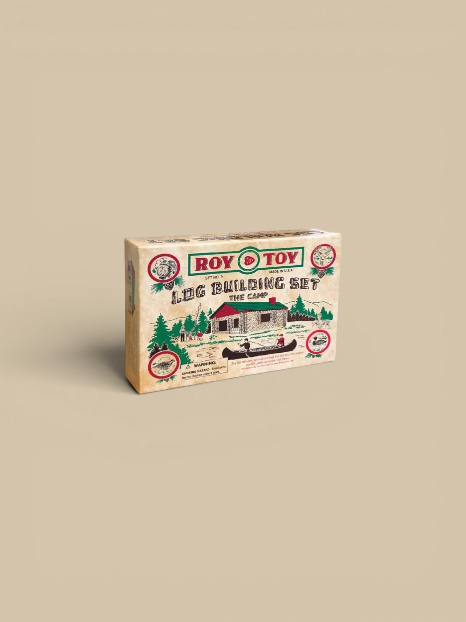 Homestyle Collective Roy Toy 1930's Log Building Set, wooden log cabin construction toy with green roof, canoe, and forest animals.