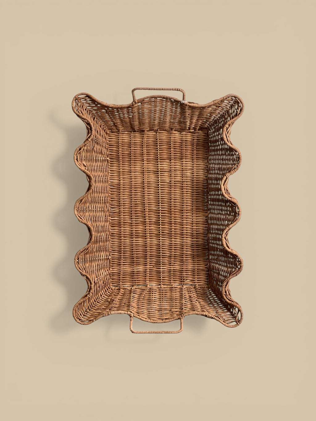 Homestyle Collective scalloped nesting rattan tray set with handles, natural finish. Set of 2.