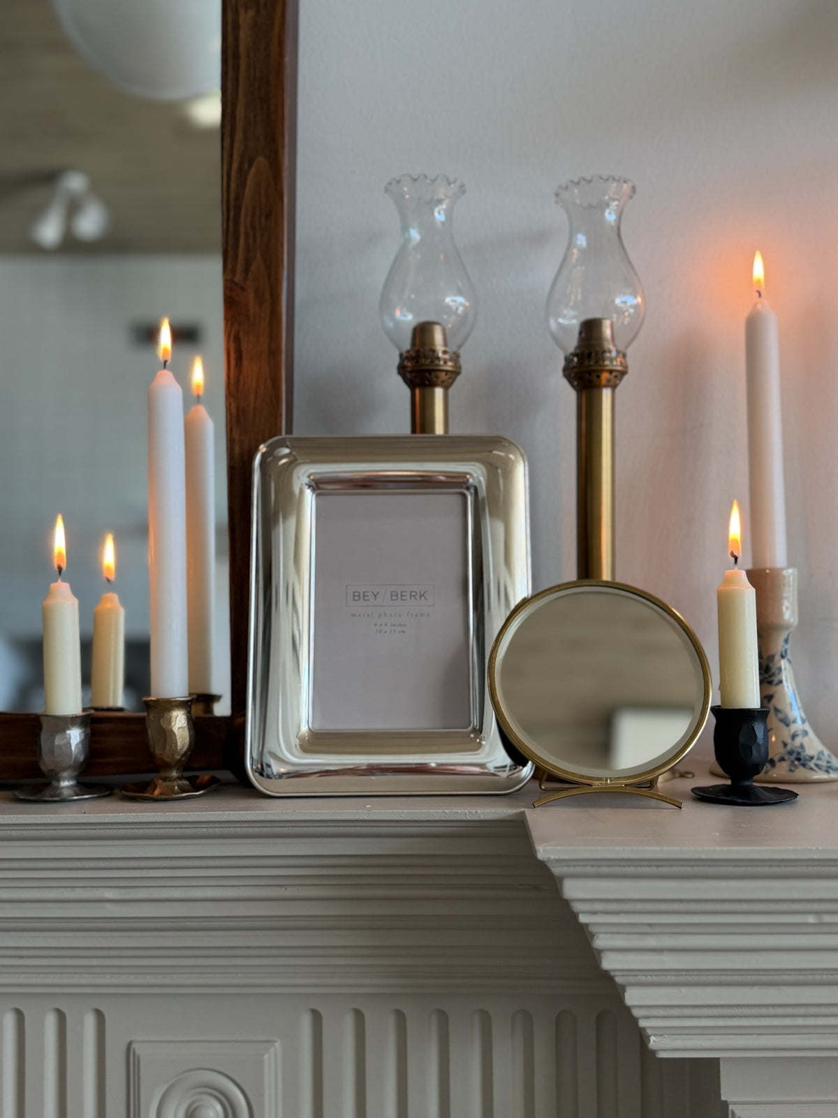 Homestyle Collective silver-plated 4x6 picture frame with easel back displayed on a mantel with candles