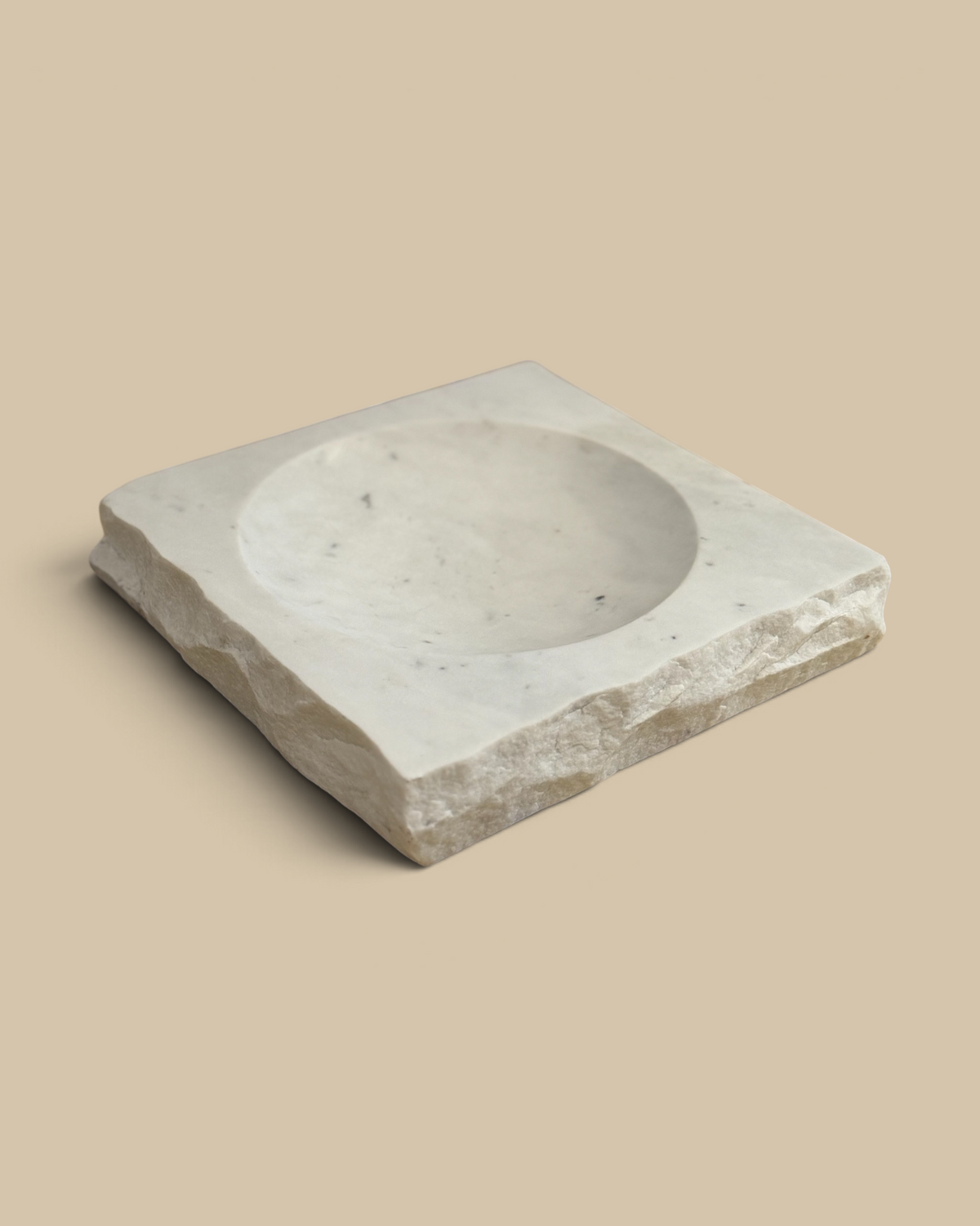 Homestyle Collective square white marble bowl with a textured rock-finish edge and smooth interior basin.