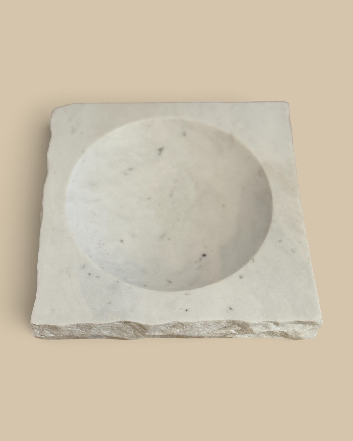Homestyle Collective square white marble bowl featuring a smooth interior basin and a textured rock-finish edge.