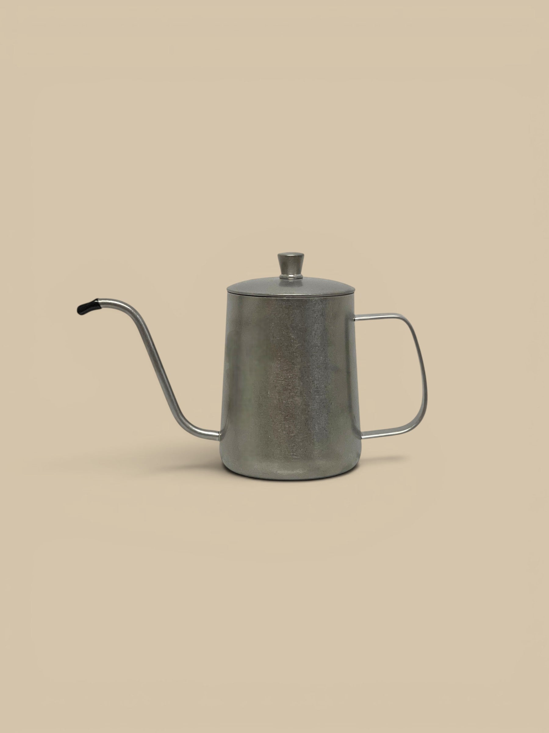 Homestyle Collective stainless steel cruet with a gooseneck spout and lid, perfect for oils, vinegars, or syrups.