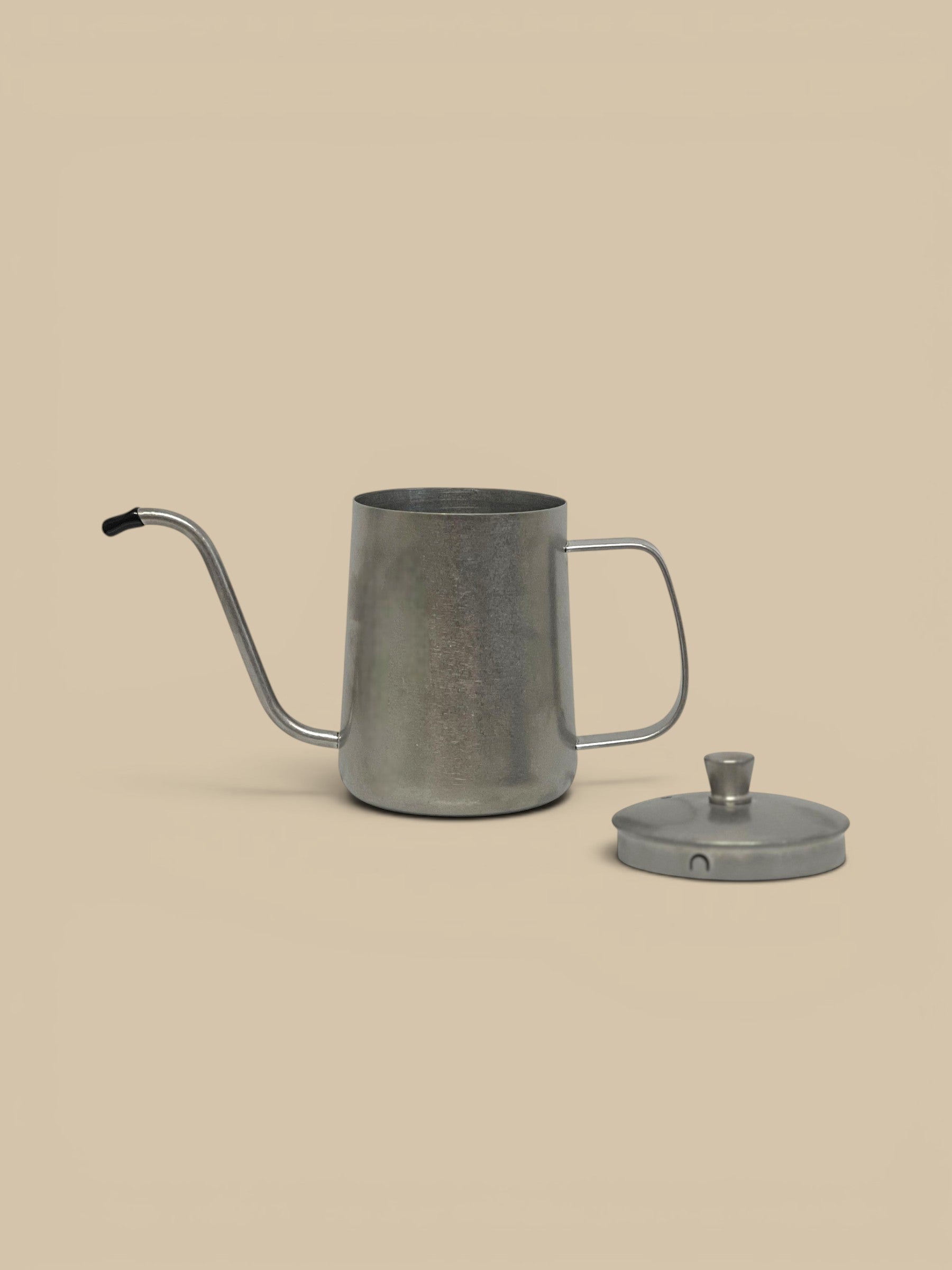 Homestyle Collective stainless steel cruet with precision pour spout and lid. Sleek, modern, cylindrical design.