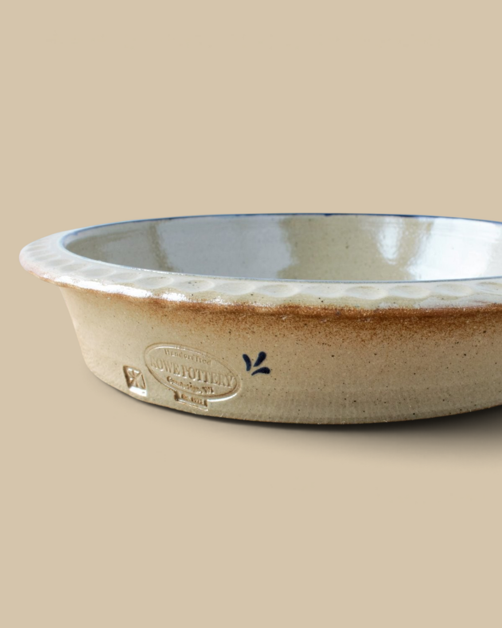 Homestyle Collective handcrafted stoneware deep dish pie plate with a scalloped edge and rustic beige glaze finish.