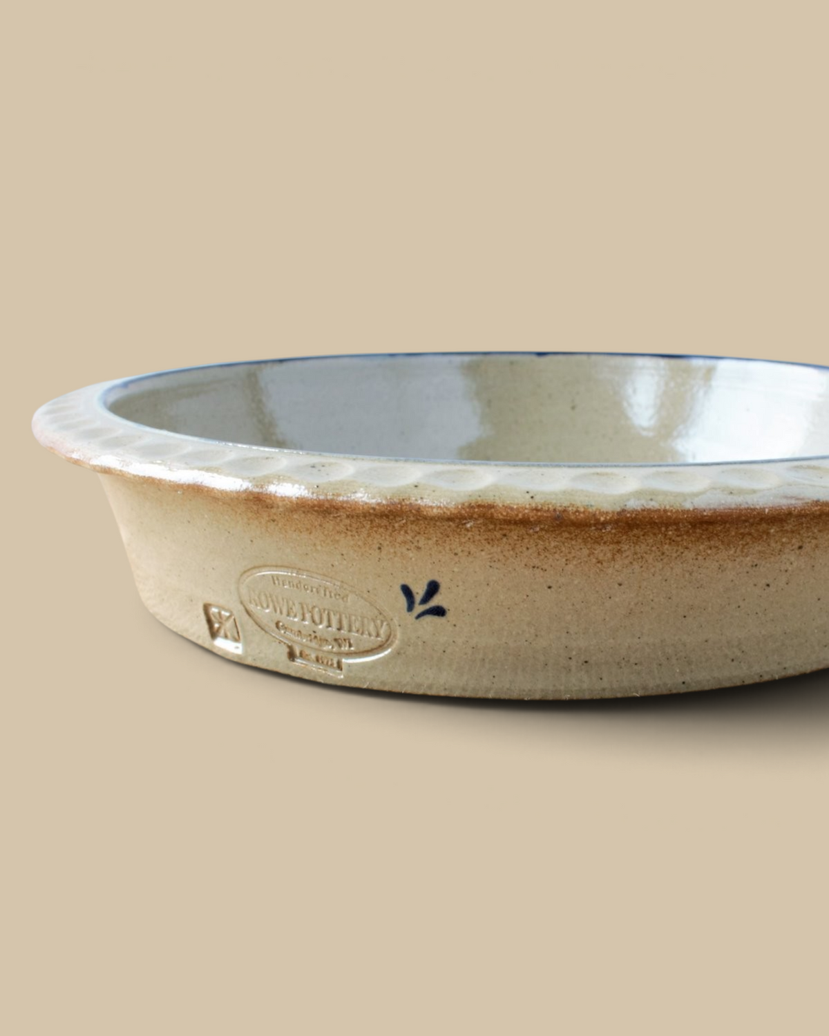 Homestyle Collective handcrafted stoneware deep dish pie plate with a scalloped edge and rustic beige glaze finish.