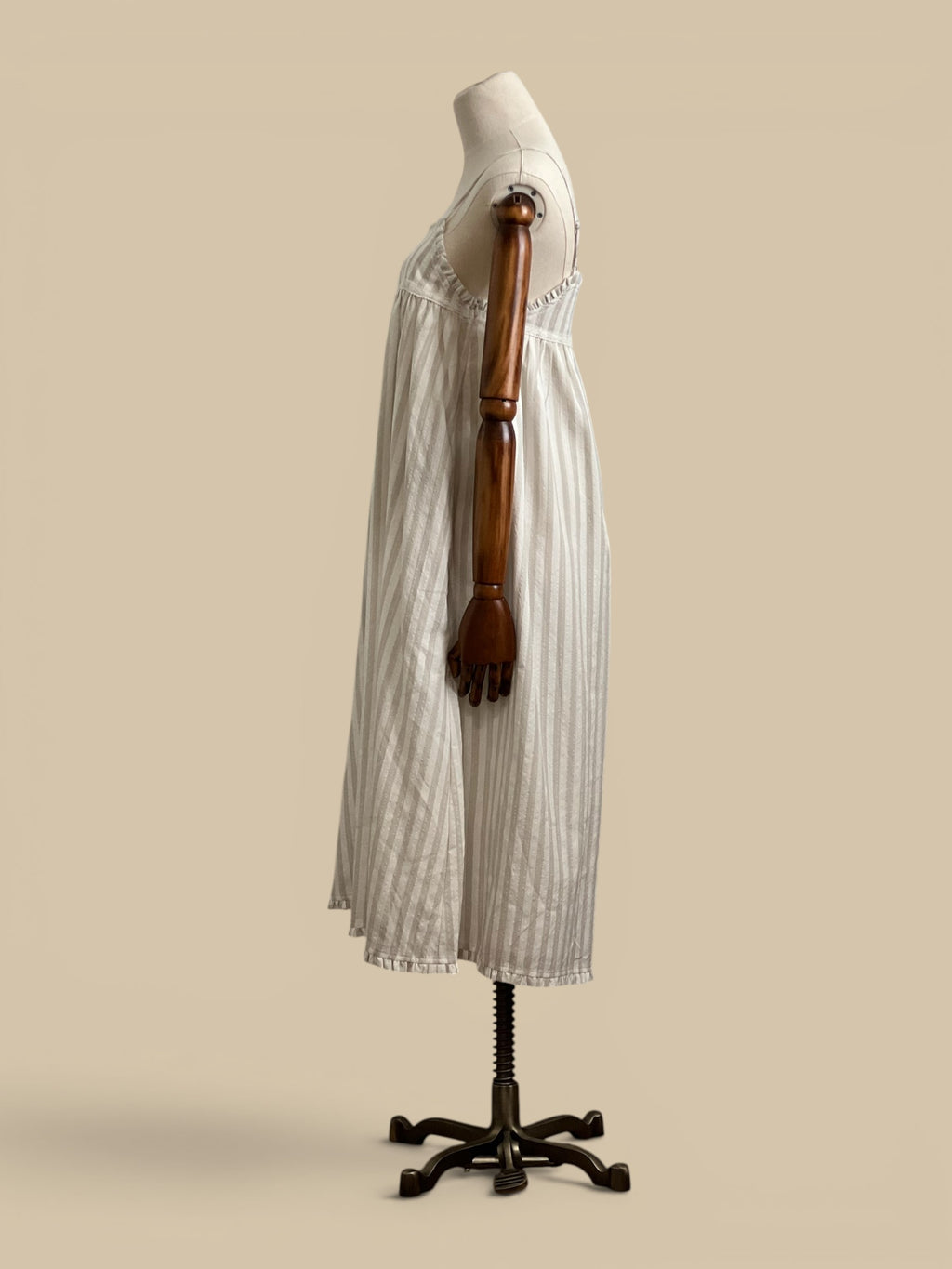 Homestyle Collective beige and white striped rayon-polyester blend midi dress with embroidered detail and ruffled hem.