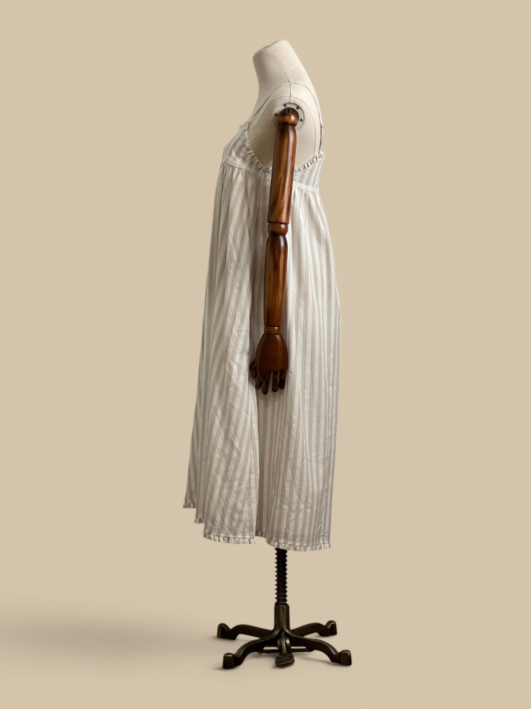 Homestyle Collective beige and white striped rayon-polyester blend midi dress with embroidered detail and ruffled hem.