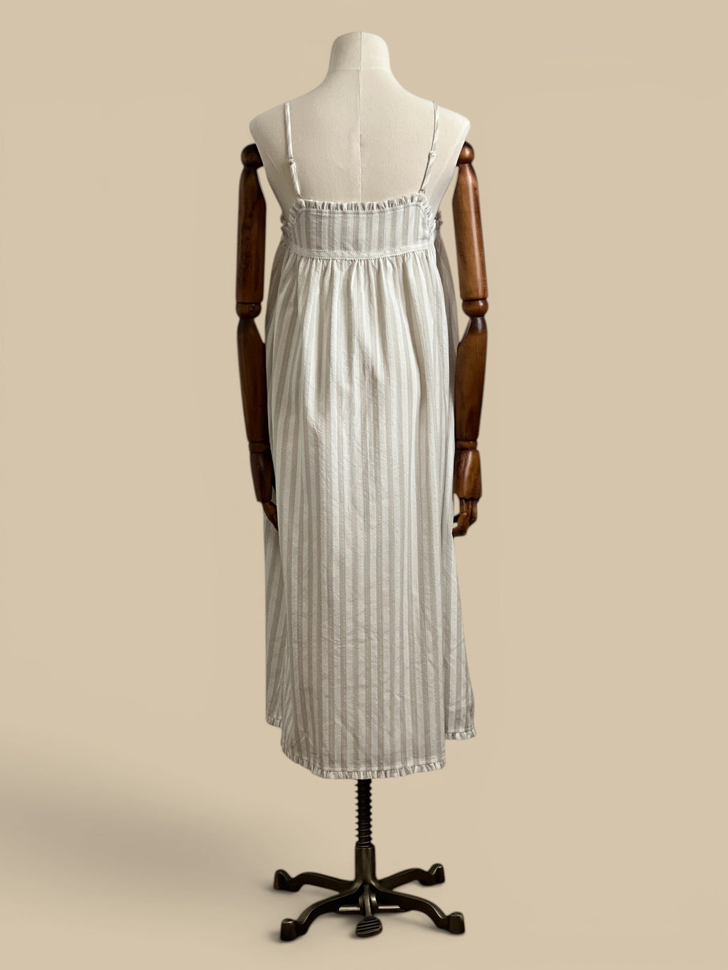 Homestyle Collective beige and white striped midi dress with embroidered detail and ruffled neckline. Rayon and polyester blend.