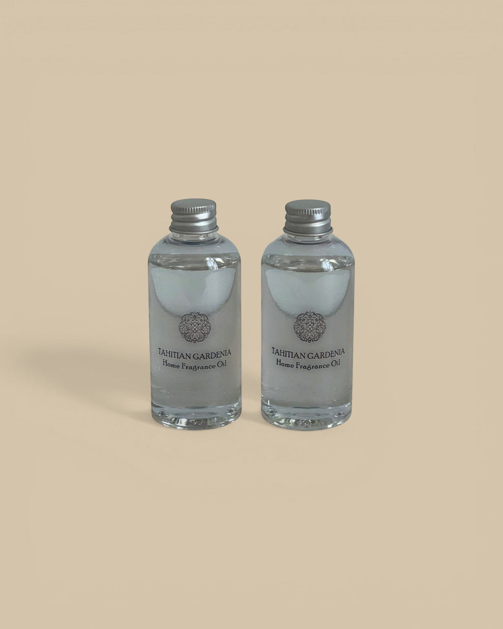 Homestyle Collective Grand Casablanca Porcelain Diffuser Tahitian Gardenia home fragrance oil in clear glass bottles with silver caps.