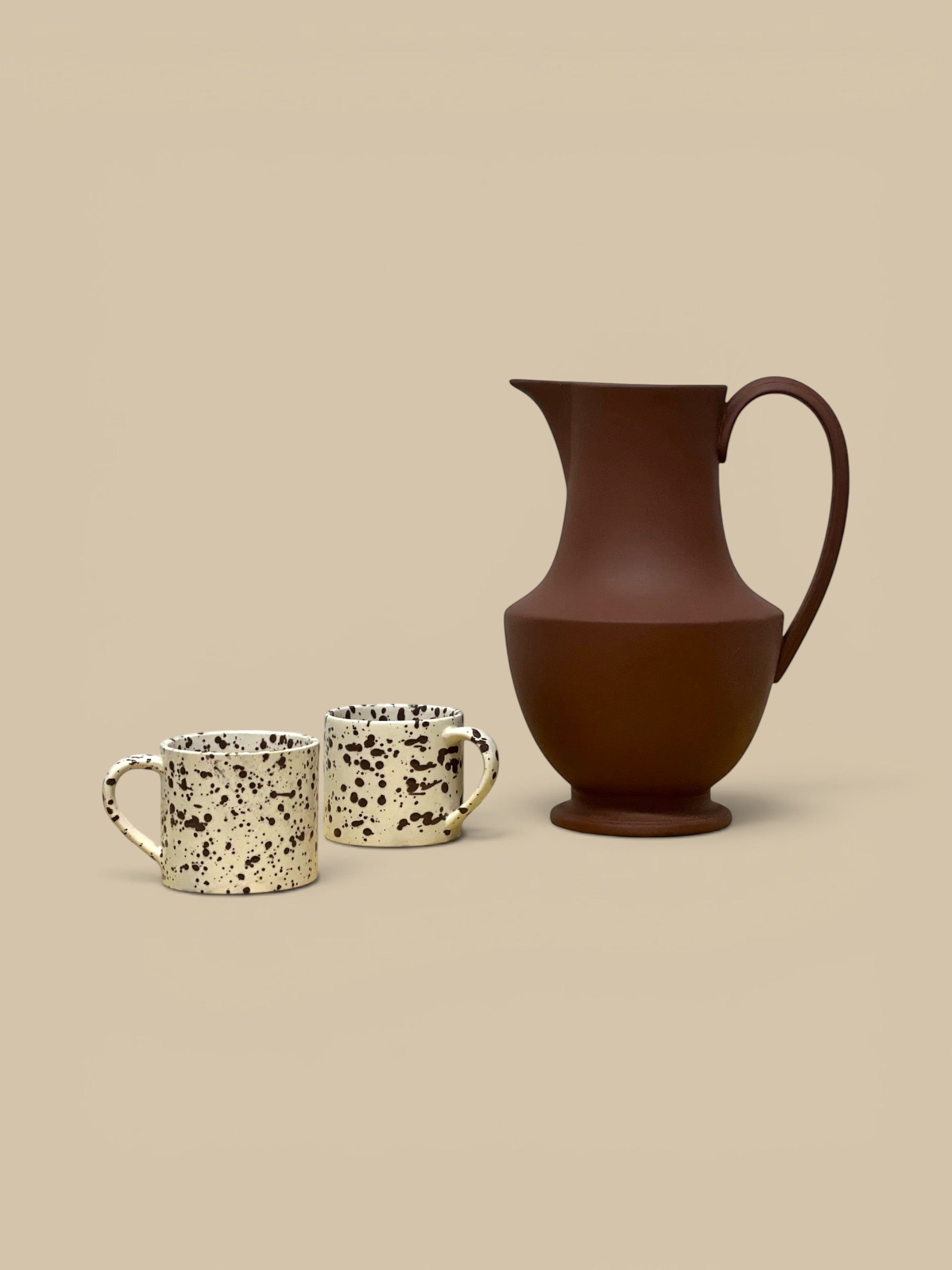 Homestyle Collective terra cotta stoneware pitcher with crisp lines and a modern silhouette. Handmade in Sri Lanka.