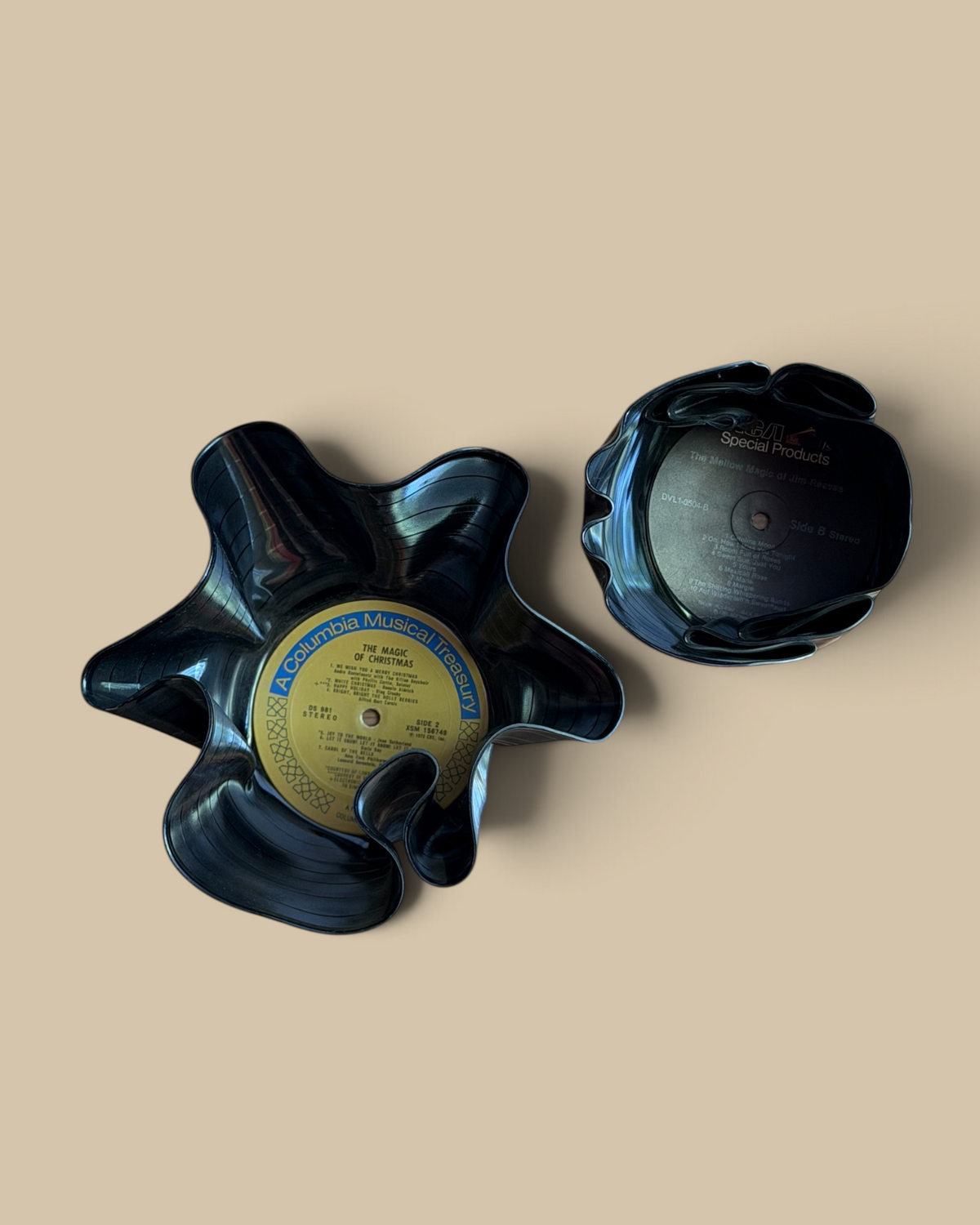 Homestyle Collective set of two upcycled vintage vinyl record bowls with wavy edges on a wooden surface