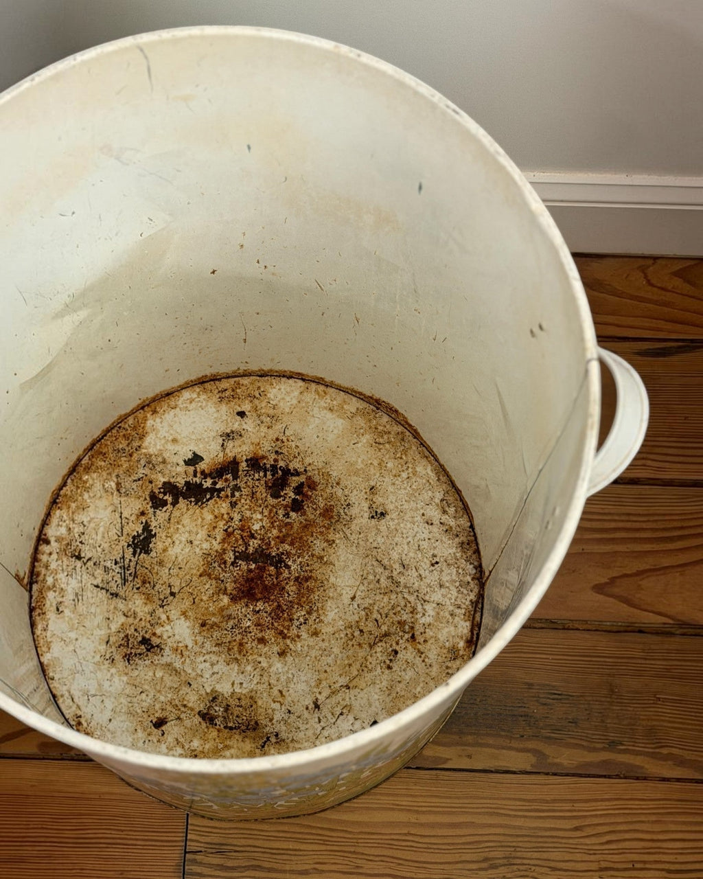 Homestyle Collective vintage MCM floral garbage can interior showing aged metal patina and signs of past use