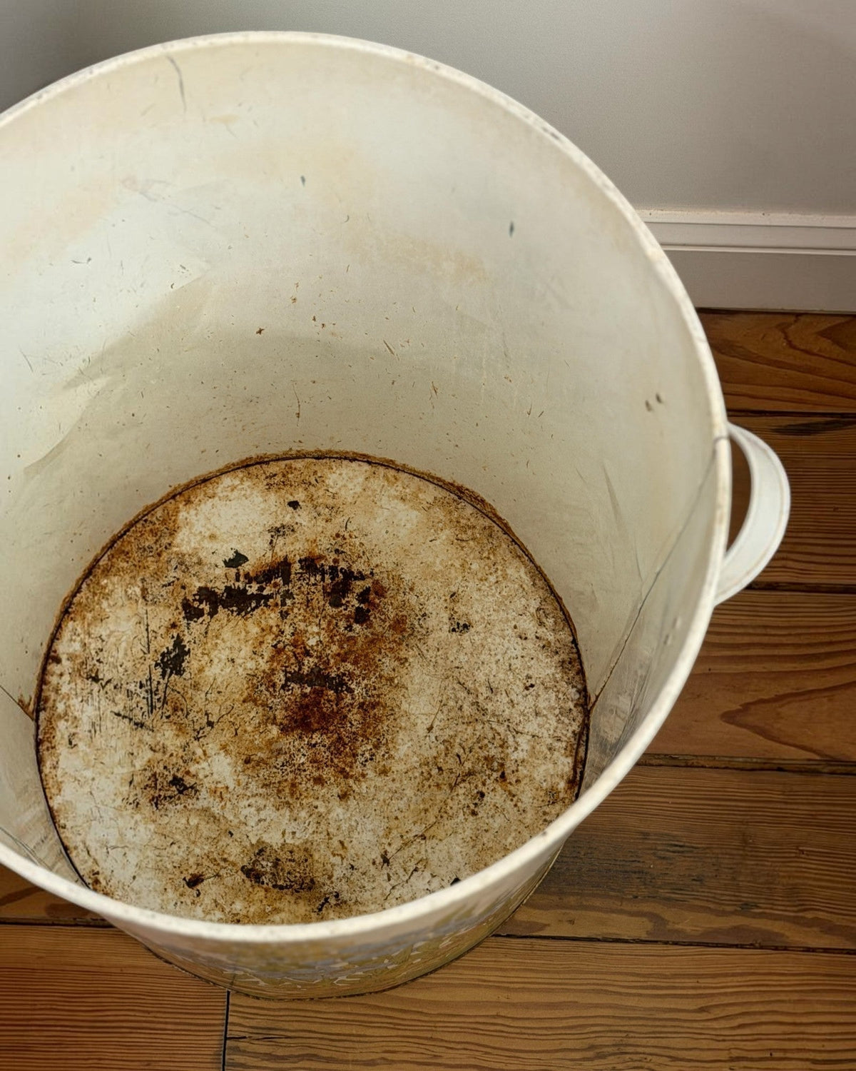 Homestyle Collective vintage MCM floral garbage can interior showing aged metal patina and signs of past use