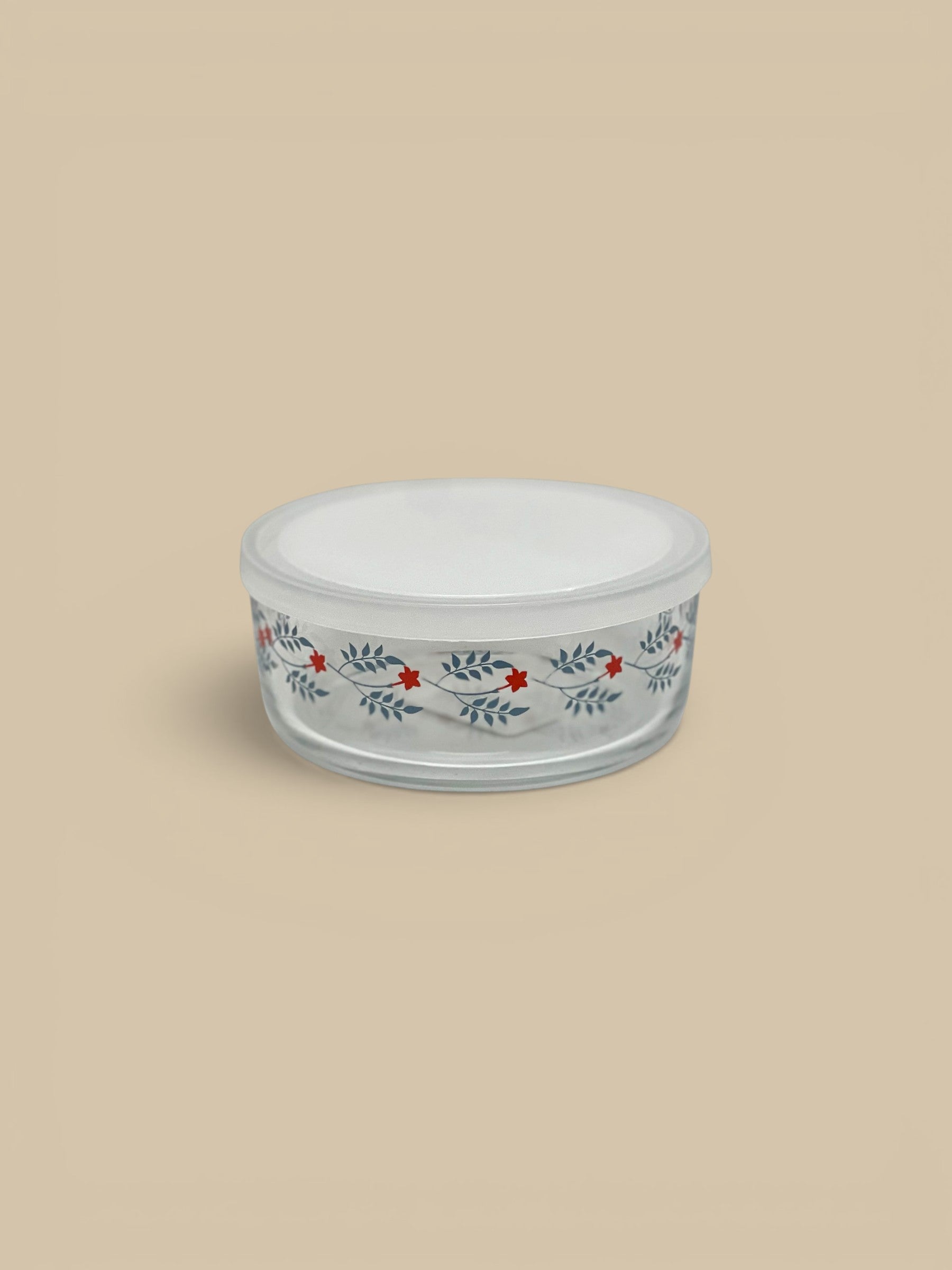 Homestyle Collective glass storage bowl with a white lid, featuring a vintage floral pattern of red flowers and blue leaves.