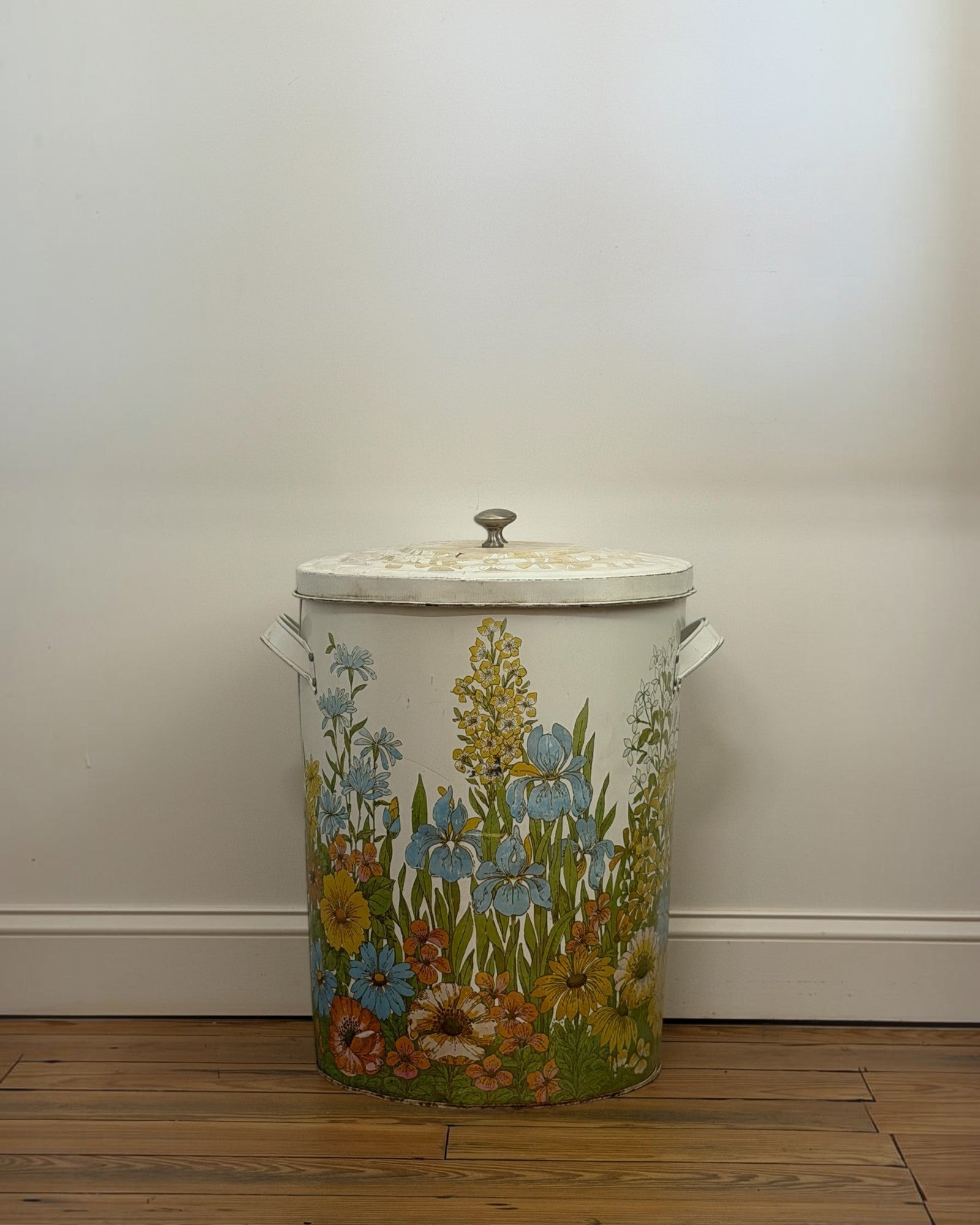 Homestyle Collective vintage 20-gallon metal garbage can with a colorful 1970s floral print and airtight lid