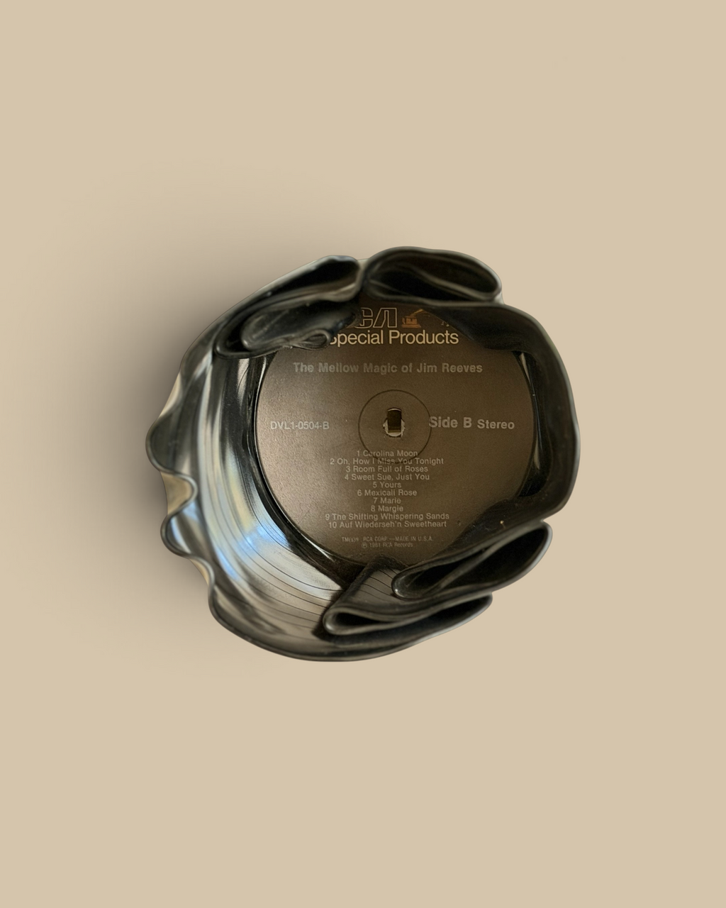 Homestyle Collective vintage vinyl record bowl with Jim Reeves label, melted into a unique black decorative vessel.