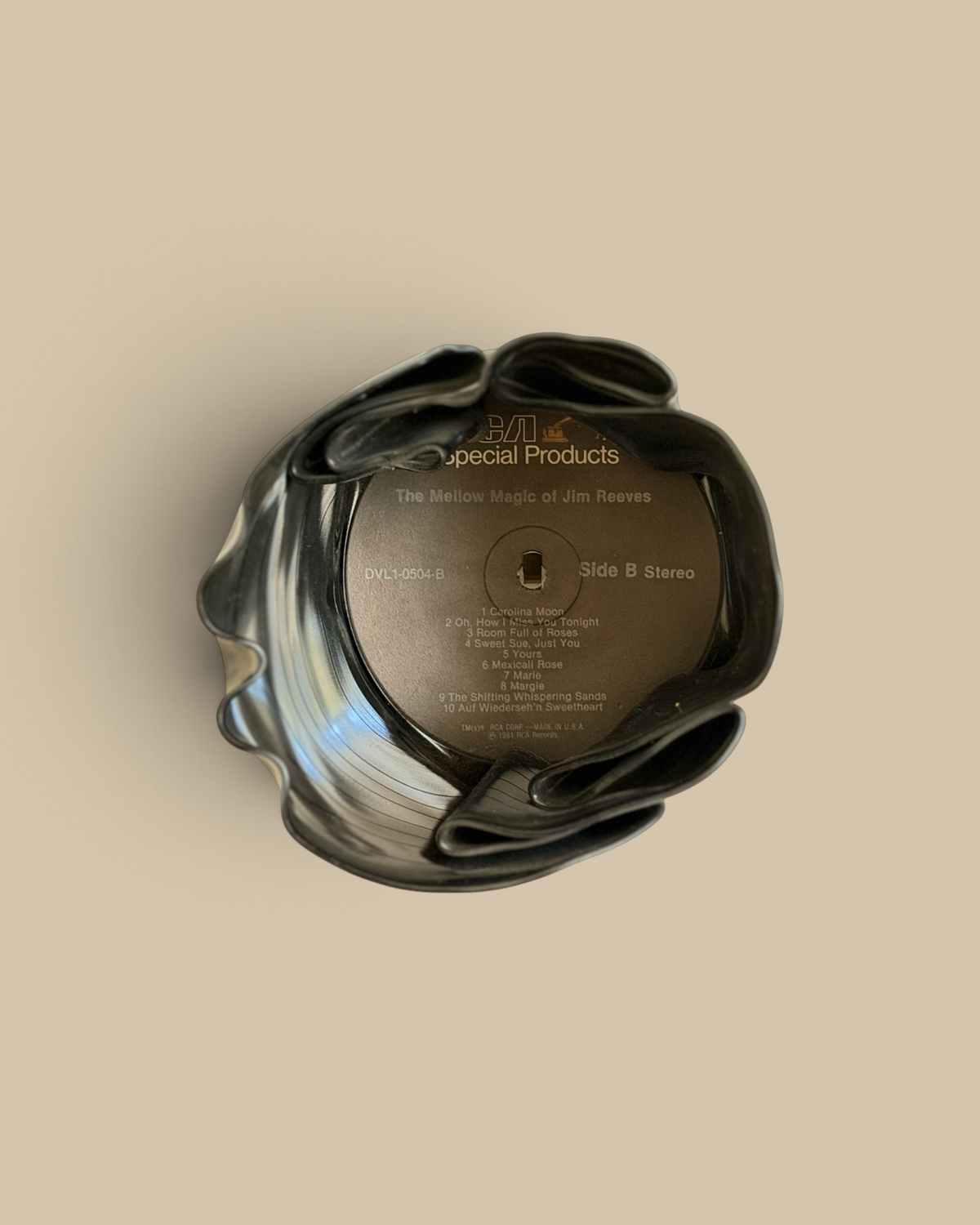 Homestyle Collective vintage vinyl record bowl with Jim Reeves label, melted into a unique black decorative vessel.