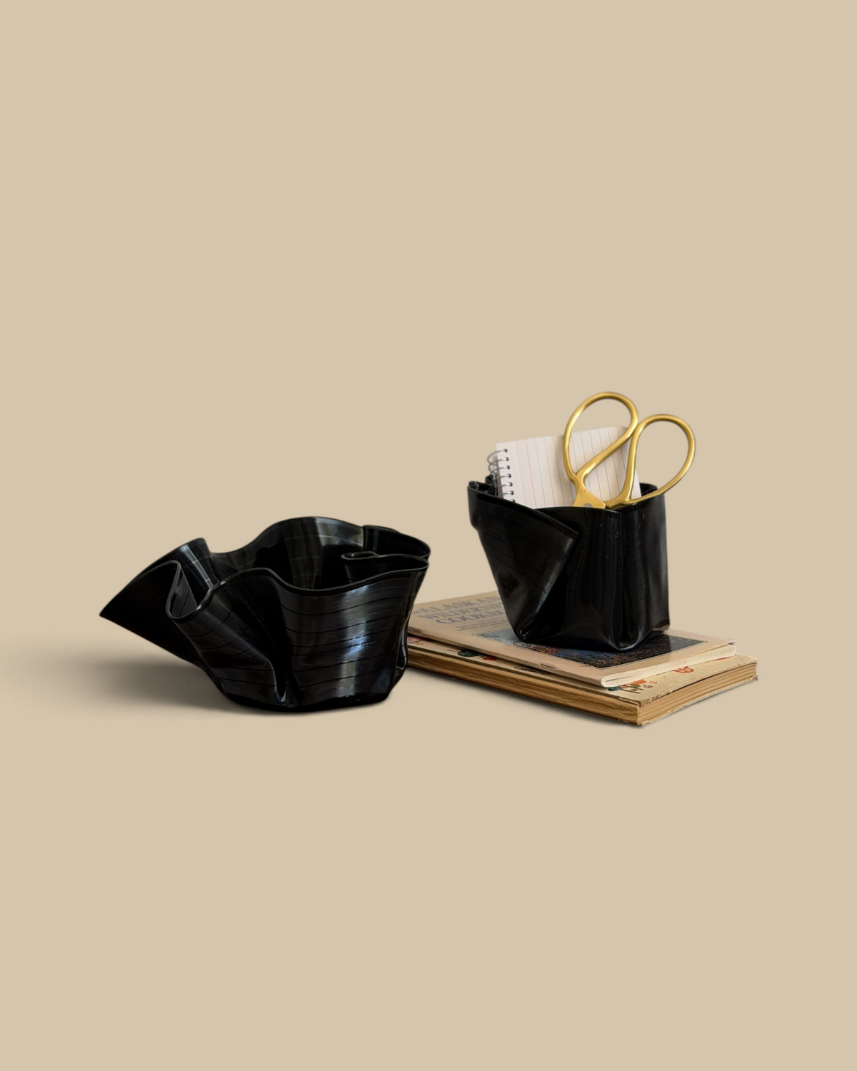 Homestyle Collective set of two black melted vintage vinyl record bowls used for desktop organization