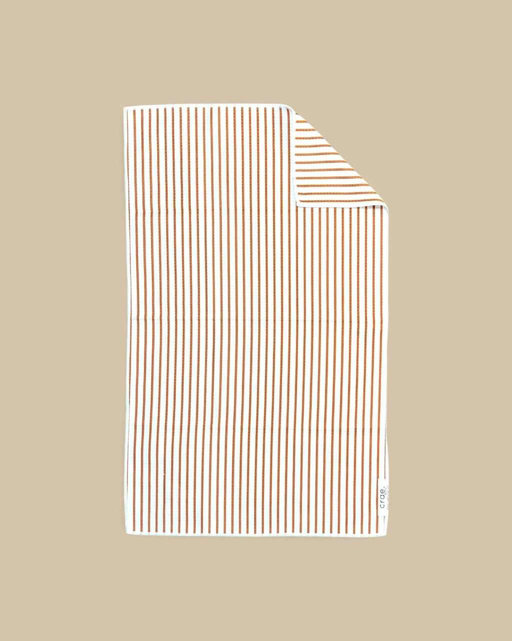 Homestyle Collective white waffle weave hand towel with thin brown vertical stripes