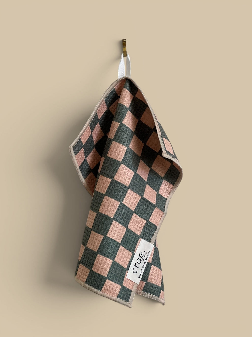 Homestyle Collective pink and grey checkered waffle weave microfiber washcloth, 12x12 inches, double-sided and absorbent.