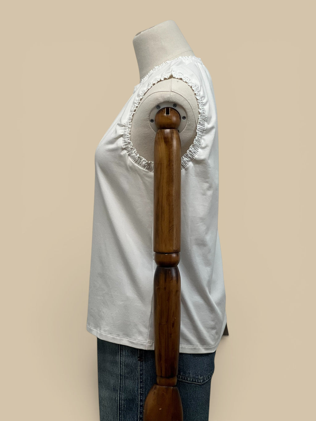 Homestyle Collective white cotton jersey tank top with ruffle detail on neckline and armholes.