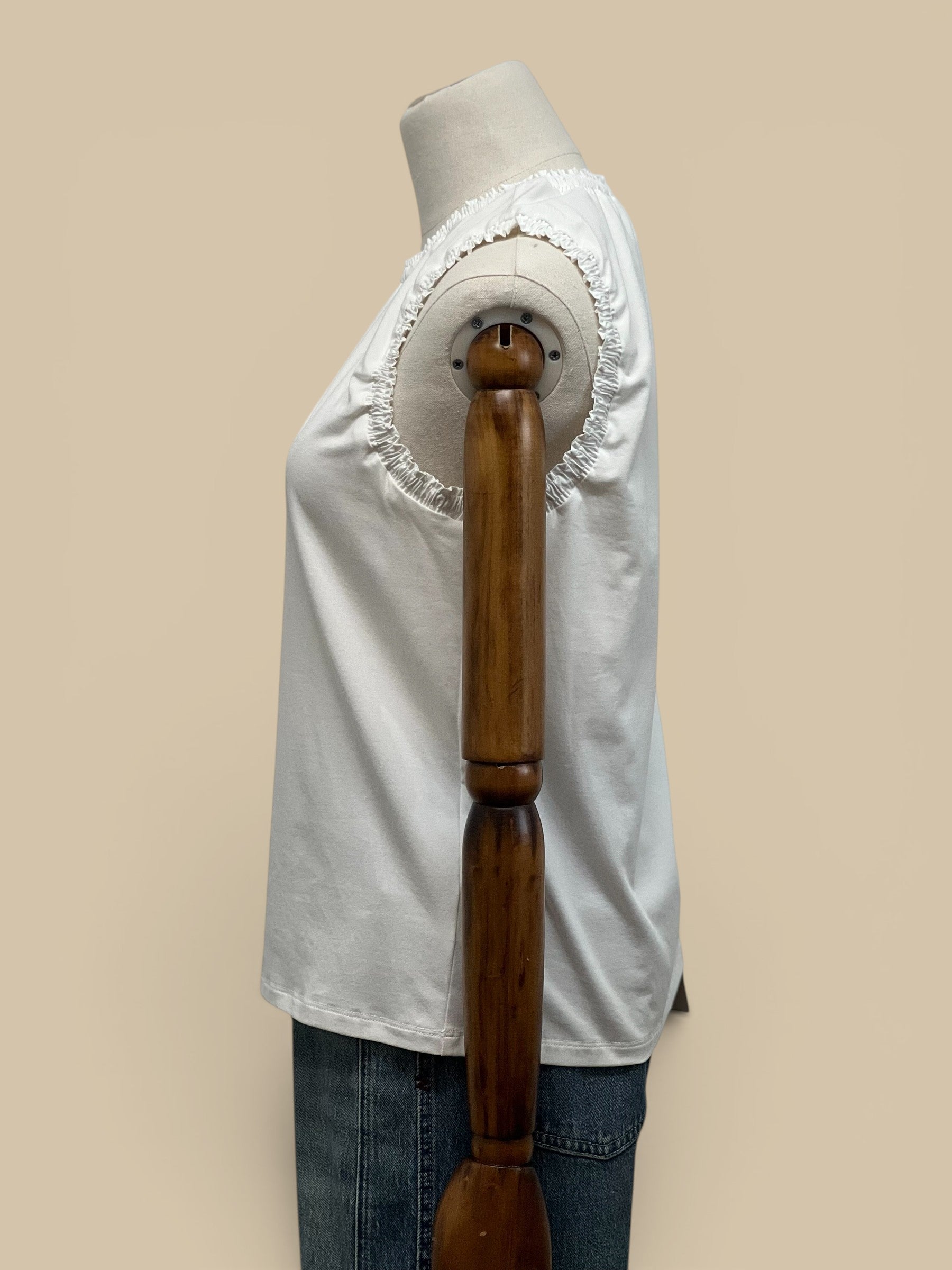Homestyle Collective white cotton jersey tank top with ruffle detail on neckline and armholes.
