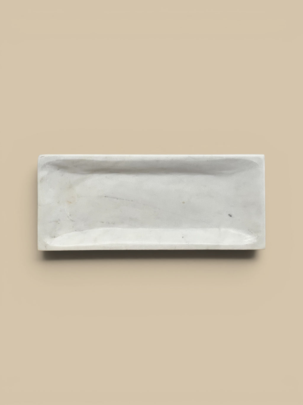 Homestyle Collective white marble rectangular decorative tray with a subtly mottled finish and raised edge, 14.5" L x 6.5" W.