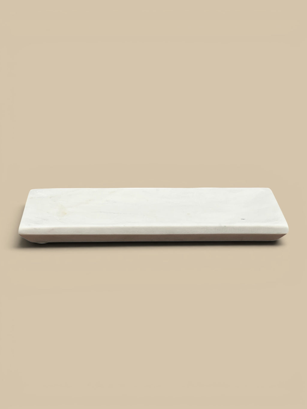 Homestyle Collective white marble rectangular decorative tray with a subtly mottled finish and raised edge.