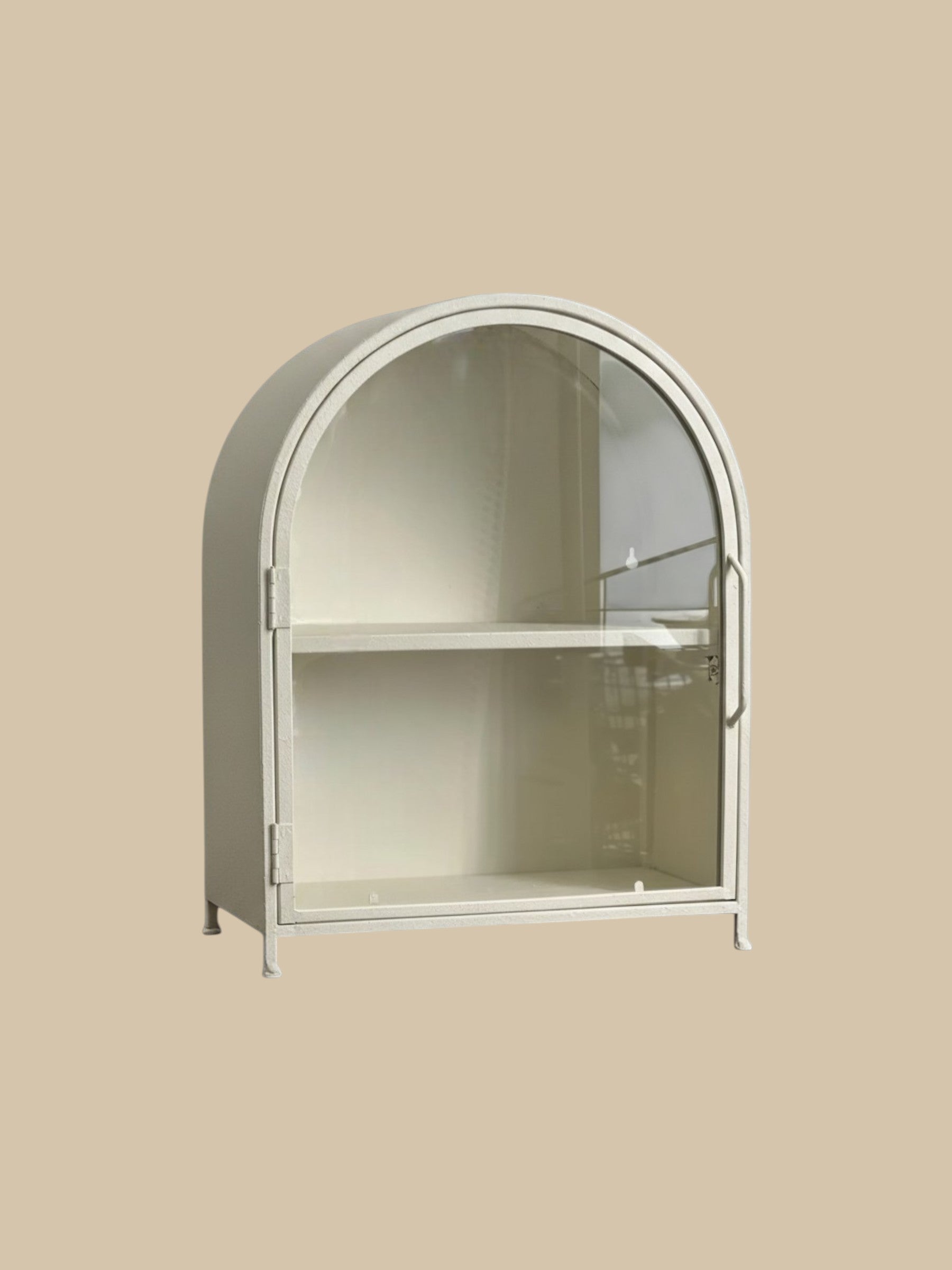 Homestyle Collective textured white metal arch display cabinet with clear glass door and one interior shelf.