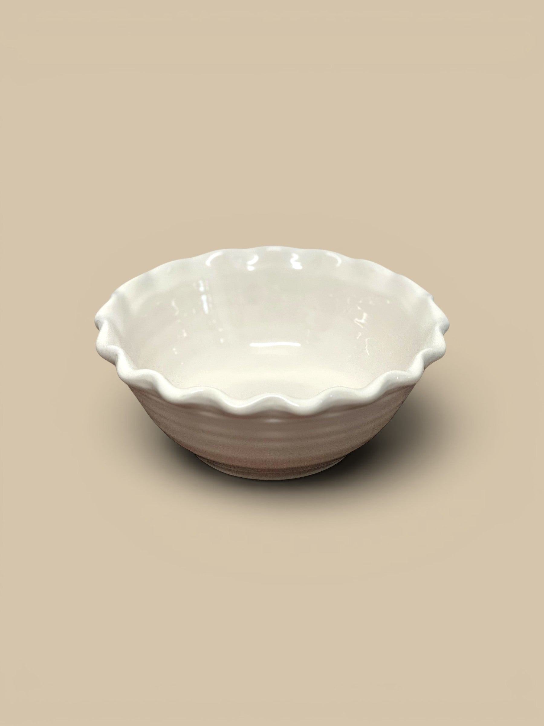 Homestyle Collective white scalloped stoneware serving bowl with ruffled edges, perfect for salads or snacks.