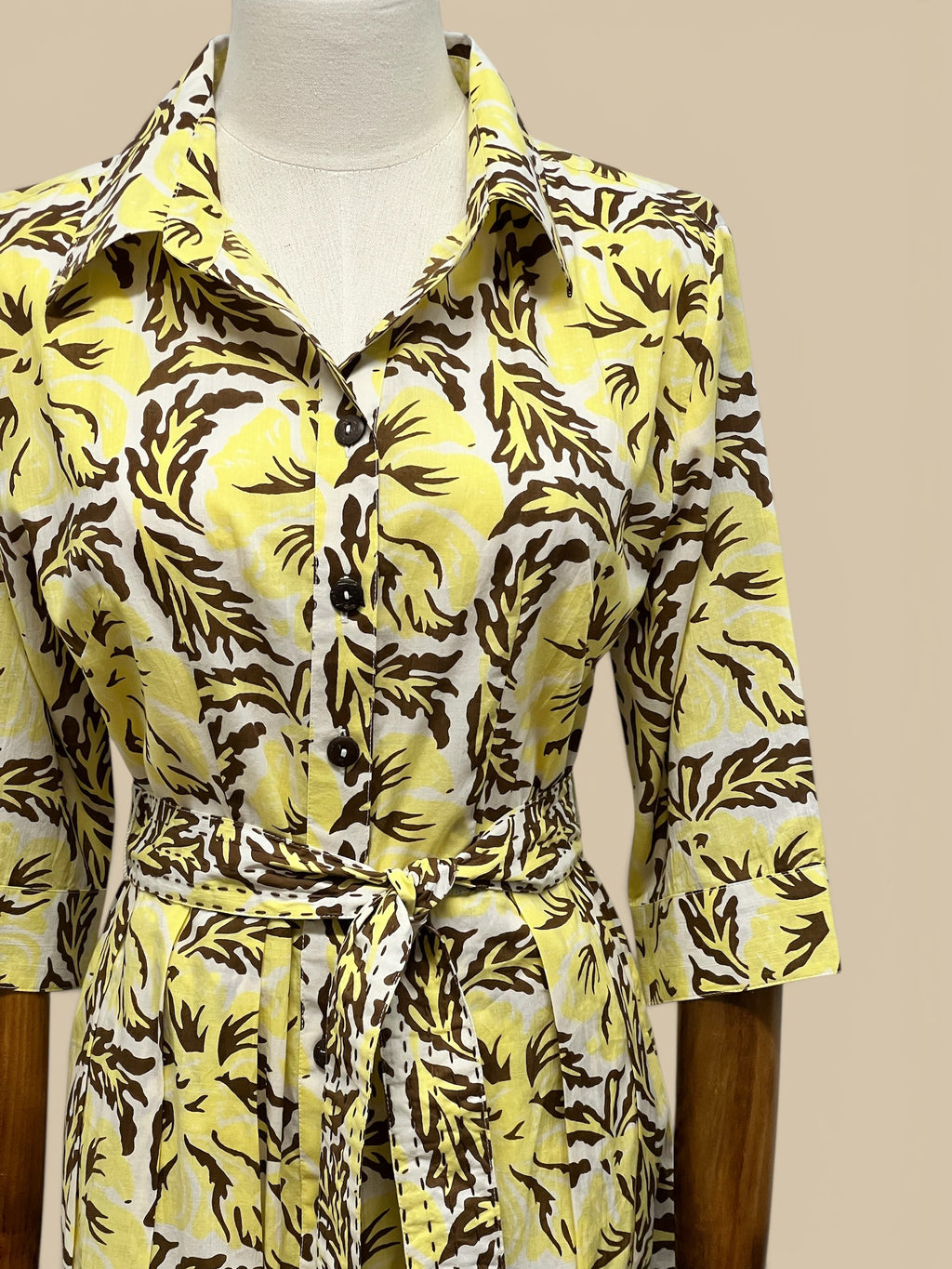 Homestyle Collective yellow and brown floral print 100% cotton Capri Sun Dress with coconut buttons and tie waist.