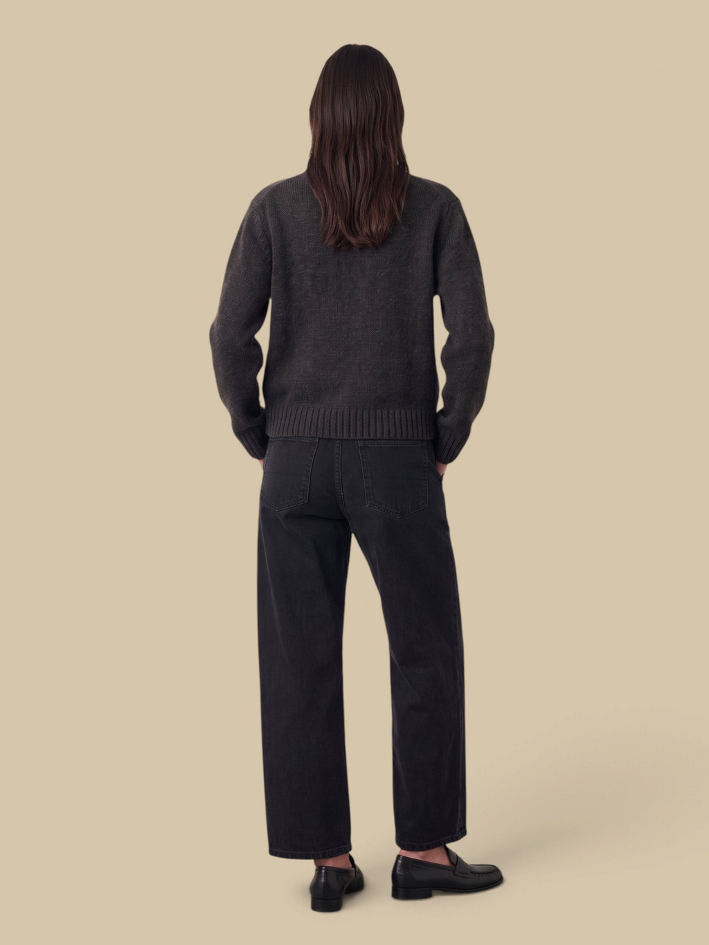 Homestyle Collective BNA Soft Curve Barrel Jeans in Nightbird black denim worn with a dark sweater and loafers