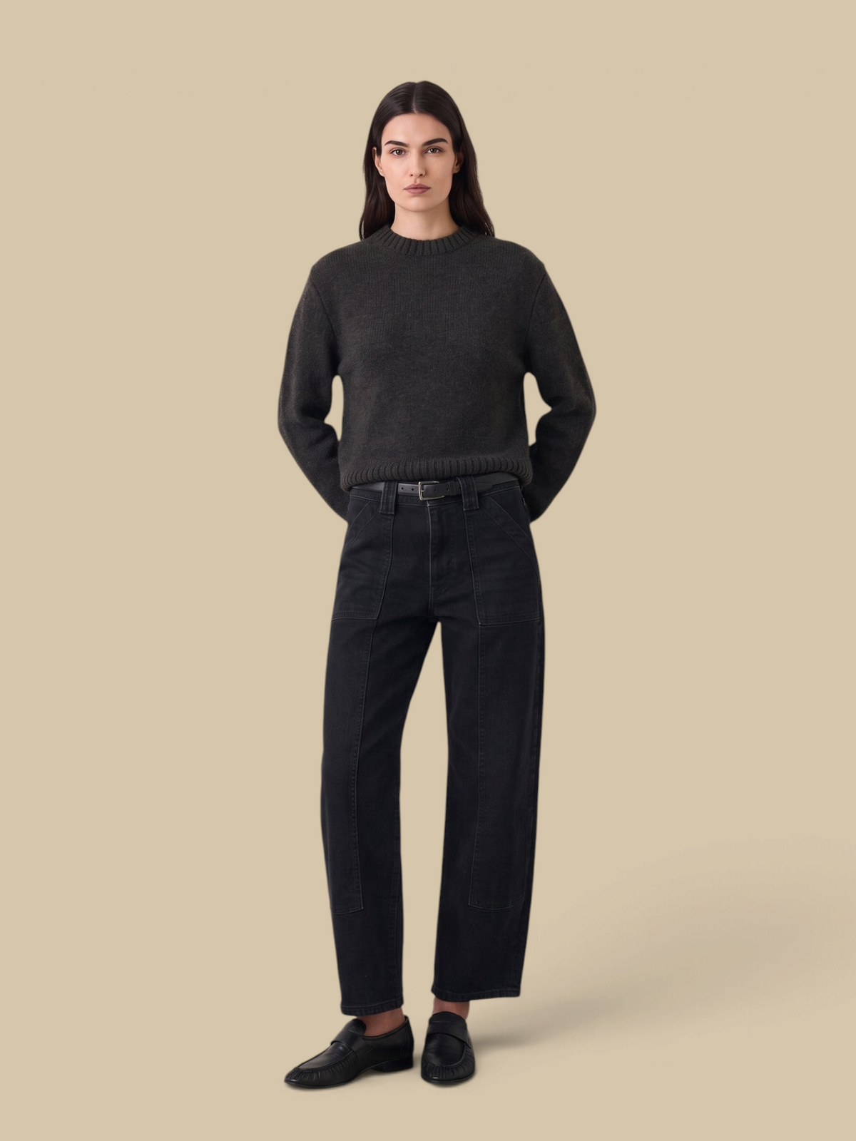 Model wearing Homestyle Collective BNA Soft Curve Barrel Jeans in Nightbird wash with workwear pockets and knee darts.